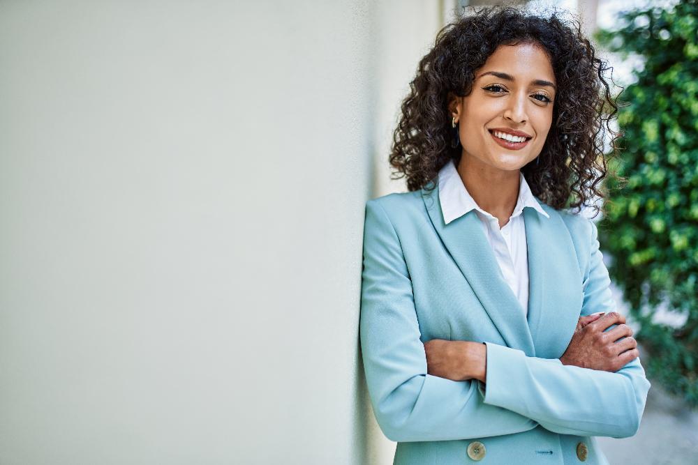 woman with curly hair smiling | teeth whitening west chester oh