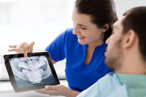 dentist showing dental x ray