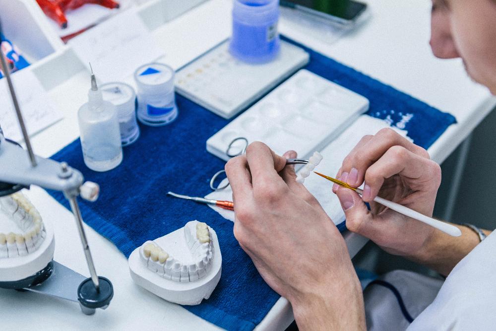 dentist creating dentures in lab | dentures west chester oh