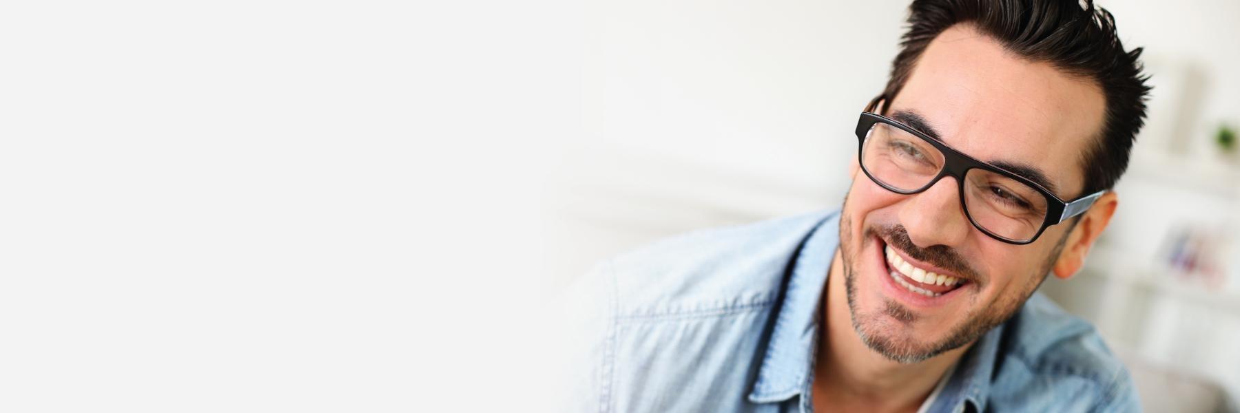 Man smiling with glasses