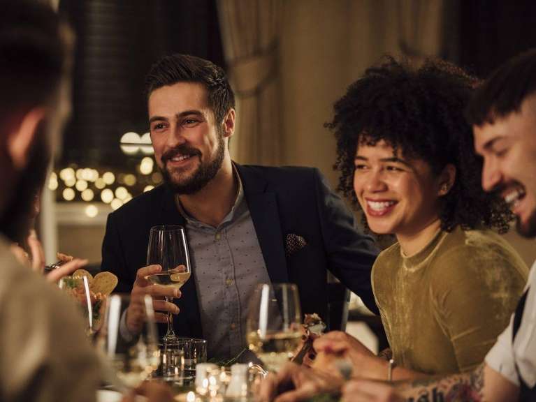 Group of friends in West Chester OH drinking wines with their veneers