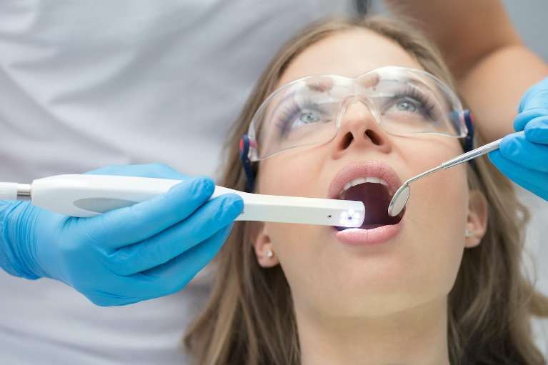 initial consultation of a woman for dental implant in West Chester OH