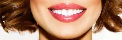 patient with red lip stick smiling | dentist west chester ohio