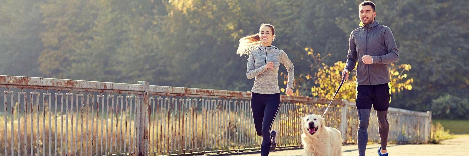 Couple jogging with their dog in West Chester, OH